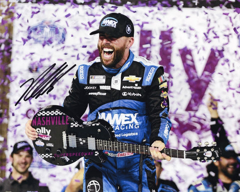 Own a piece of racing history with this authentic autographed 8x10 inch NASCAR photo of Ross Chastain celebrating his 2023 Nashville win with the iconic Victory Lane guitar. Certificate of Authenticity included.