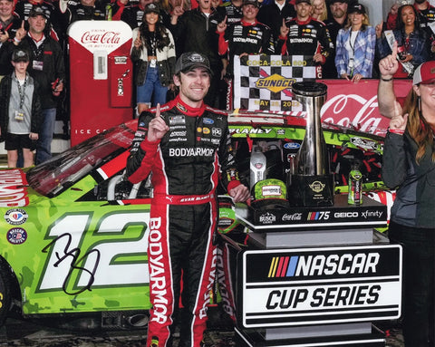 Relive the championship glory with this autographed masterpiece. The AUTOGRAPHED 8x10 Inch Charlotte Victory Lane NASCAR Photo immortalizes Ryan Blaney's triumphant 2023 #12 Body Armor COCA-COLA 600 WIN. Every autograph is carefully obtained through exclusive public/private signings and HOT Pass access, guaranteeing its genuineness.