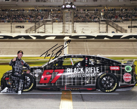 Autographed Travis Pastrana 2023 DAYTONA 500 Pit Road NASCAR Photo - Close-up view of Travis Pastrana's signature on the picture.