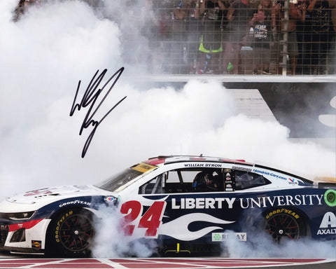 This exclusive collectible features an autographed 2023 William Byron #24 Liberty University TEXAS WIN NASCAR photo, capturing the exhilarating moment as Byron performs a thrilling burnout celebration at Texas Motor Speedway. Each signature is meticulously obtained through exclusive public/private signings and garage area access via HOT Passes, guaranteeing unparalleled authenticity.