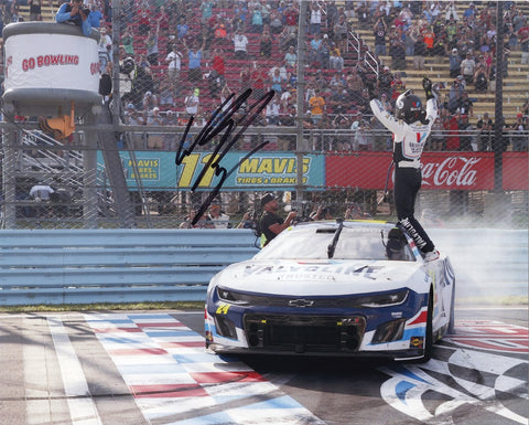 This autographed 2023 William Byron #24 Valvoline WATKINS GLEN WIN NASCAR photo immortalizes the electrifying moment as Byron triumphantly crosses the finish line at Watkins Glen International. Each signature is meticulously acquired through exclusive public/private signings and garage area access via HOT Passes, ensuring unparalleled authenticity.