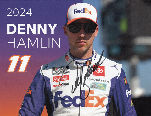 Autographed 2024 Denny Hamlin #11 FedEx Racing official hero card glossy photo with Certificate of Authenticity, showcasing Hamlin's dynamic presence on the track, obtained through exclusive signings and garage area access via HOT Passes, making it a prized possession for racing enthusiasts and collectors alike.