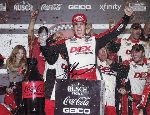 Relive Harrison Burton’s historic first win at Daytona in 2024 with this signed 9x11 glossy photo. Featuring Burton in Victory Lane with the #21 Wood Brothers car, the photo comes with a COA, offering fans a genuine piece of NASCAR history.