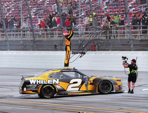 Celebrate Jesse Love's incredible rookie season win at Talladega in 2024 with this autographed 9x11 glossy photo. Featuring the Xfinity Series victory, the signed photo includes a COA, ensuring authenticity. It’s the perfect addition to any NASCAR collection.