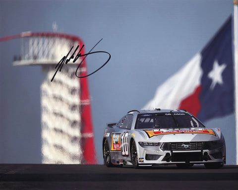 Relive Noah Gragson’s exciting race at the 2024 COTA with this signed 8x10 photo, featuring the Texas flag in the background. The photo is hand-signed and comes with a Certificate of Authenticity (COA), making it a valuable piece for collectors.