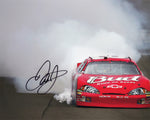 Experience the adrenaline of NASCAR with this autographed 8X10-inch glossy photo, showcasing Dale Earnhardt Jr.'s iconic RACE WIN BURNOUT celebration.