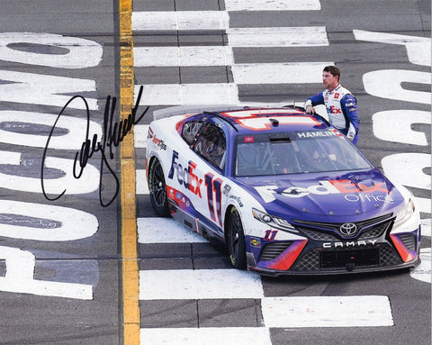 Celebrate Denny Hamlin's Pocono Race victory with this autographed 8X10-inch glossy photo, capturing the thrill of the finish line celebration.