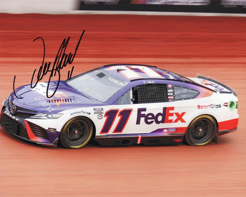 Relive the high-octane excitement of the 2023 BRISTOL DIRT RACE with this AUTOGRAPHED 8x10 Inch NASCAR Photo featuring Denny Hamlin #11 FedEx Racing and the revolutionary Next Gen Car. Exclusively available at Trackside Signatures, this collector's gem showcases Hamlin's mastery on the challenging dirt track. Trust in the authenticity of Trackside Signatures, where each signature is acquired through exclusive public/private signings and privileged garage access via HOT Passes. 