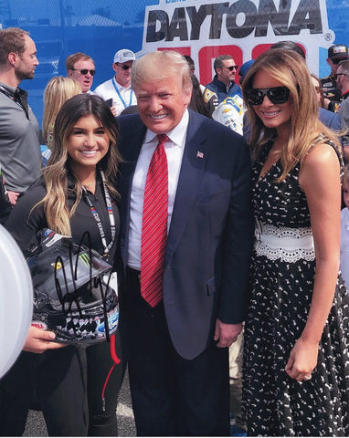 Capture a historic moment with this autographed Hailie Deegan 2020 Daytona 500 photo, featuring President Donald Trump and Melania at the iconic NASCAR race.