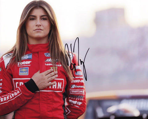 Dive into the adrenaline-fueled world of NASCAR with the AUTOGRAPHED Hailie Deegan 2021 Craftsman Pre-Race 8x10 Inch Glossy Photo. This captivating piece features Hailie Deegan gearing up for action, her signature obtained through exclusive signings and garage area access via HOT Passes. 