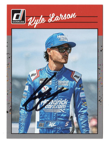 Delve into the world of NASCAR with a Kyle Larson 2023 Donruss Racing RETRO Gray Parallel Insert autographed collectible trading card, authenticated with a Certificate of Authenticity and ready to be cherished by racing fans everywhere.