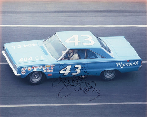 Vintage signed 8x10 photo of Richard Petty’s 1966 #43 Plymouth car at the Daytona 500, a classic collectible that highlights a milestone in NASCAR history.