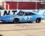 Autographed 1970 Richard Petty #43 STP Racing Plymouth Superbird 8x10 photo, signed by "The King" himself, featuring a high-quality glossy image of the iconic car. Includes a COA for guaranteed authenticity, making it a great addition to any NASCAR collection.