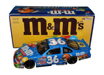 Autographed 1999 Ernie Irvan #36 M&M's Crispy Racing diecast car. This collectible, signed through exclusive public and private signings with HOT Pass access, includes a Certificate of Authenticity and a lifetime authenticity guarantee. Ideal gift for NASCAR fans and collectors.