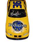 1999 Ernie Irvan #36 Pedigree Racing diecast car, signed by Ernie Irvan. This collectible includes a Certificate of Authenticity and a lifetime authenticity guarantee. Perfect for any NASCAR memorabilia collection.