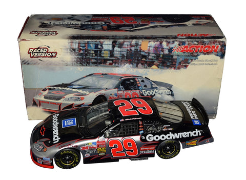 Autographed 2003 Kevin Harvick #29 Goodwrench Racing Indy Brickyard Win diecast car, featuring tire marks and blown tire details. Signed by Harvick with COA and lifetime authenticity guarantee.