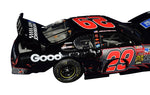 Autographed 2003 Kevin Harvick #29 Goodwrench Racing Indy Brickyard Win diecast car, featuring tire marks and blown tire details. Signed by Harvick with COA and lifetime authenticity guarantee.