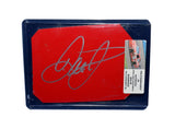 A detailed view of the 2004 Dale Earnhardt Jr. #8 Budweiser Racing race-used sheet metal, featuring a signature from Dale Jr. This rare red DEI car piece is perfect for collectors.