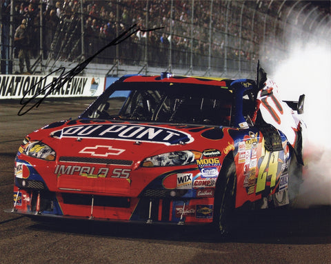 Signed photo of Jeff Gordon celebrating his 76th career NASCAR win in Phoenix with a burnout in the #24 DuPont car. Great collectible tribute to Earnhardt’s legacy.