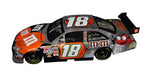 Collectible NASCAR diecast car from 2008 featuring Kyle Busch's #18 M&M's Racing Halloween Car. Unique Halloween-themed livery on a Toyota COT Camry. Signed by Kyle Busch. Numbered 1597 of 2,668. JSA Certified. Great gift for collectors and racing fans.