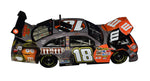 Kyle Busch #18 M&M's Racing Halloween NASCAR Diecast Car from 2008. Autographed by Kyle Busch, featuring the special Halloween design. Toyota COT Camry model, limited to 2,668 pieces. JSA COA included. A festive and rare addition to any NASCAR collection.