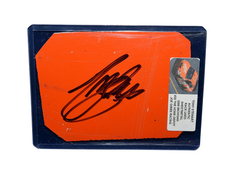 View of the autographed 2008 Tony Stewart #20 Home Depot race-used sheet metal in orange. This signed piece from Michigan Speedway fits perfectly in a plastic toploader for display and protection.