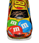 The 2010 Kyle Busch #18 M&M’s Levitatior diecast car features precise craftsmanship and authentic sponsor logos. Hand-signed by Busch and accompanied by a COA, it is a standout NASCAR collectible that appeals to fans and collectors alike.