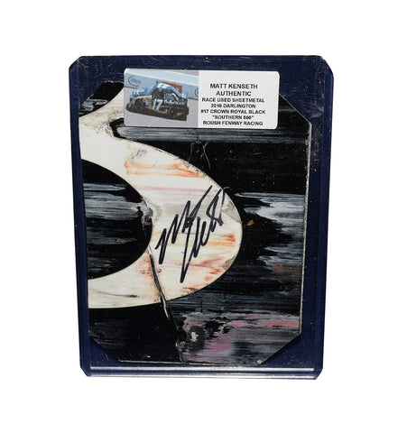 This Matt Kenseth autographed 2010 race-used sheet metal piece from the Darlington Southern 500 showcases a vibrant 2-color section and is encased in a toploader for display. A rare NASCAR collectible for fans and collectors, making it an excellent gift for motorsports enthusiasts.