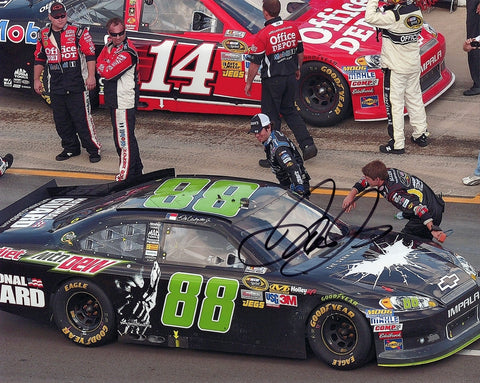 Autographed 2012 Dale Earnhardt Jr. #88 Batman Dark Knight Michigan win photo, featuring a thrilling pit road celebration. Signed with COA for authenticity, perfect for collectors.