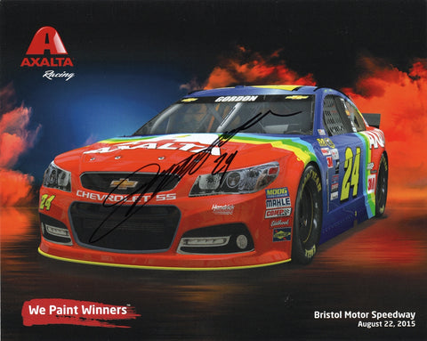 Signed 8x10 photo of Jeff Gordon’s 2015 Axalta Rainbow throwback car at Bristol, featuring a classic paint scheme and inscription. A perfect NASCAR gift for fans.