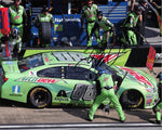 Autographed 2017 Dale Earnhardt Jr. #88 Mountain Dew Racing photo from the Talladega race, showcasing a pit crew stop moment. Signed with COA for authenticity.