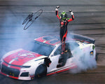 Autographed 2019 Chase Elliott #9 Little Caesars Racing Talladega Win photo. This 8x10 inch glossy image captures Elliott's victory burnout, complete with COA, making it an essential addition to any NASCAR collection.