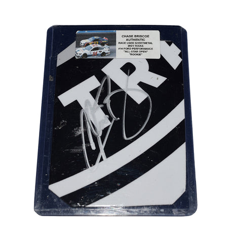 This Chase Briscoe autographed 2021 race-used sheet metal piece from the Rookie All-Star Open showcases a striking 2-color logo and is encased in a toploader for display. A rare NASCAR collectible for fans and collectors, making it an excellent gift for motorsports enthusiasts.