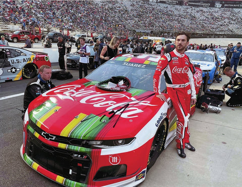 Autographed 2021 Daniel Suarez #99 Coca-Cola Racing Bristol Race 9x11 glossy photo featuring the NASCAR driver during Hispanic Heritage Month. Perfect for collectors, this photo is signed with a Certificate of Authenticity.