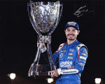 Celebrate NASCAR history with this autographed photo of Kyle Larson holding his championship trophy from the 2021 season. This 8x10 inch glossy image is signed and comes with a Certificate of Authenticity, making it a perfect collectible for fans.