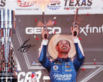 Celebrate Kyle Larson's thrilling victory at the 2021 Texas All-Star Race with this autographed photo. Capturing him in Victory Lane, this signed 8x10 inch glossy image comes with a Certificate of Authenticity, perfect for any racing fan's collection.