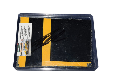 The 2022 Christopher Bell #20 DeWalt Racing race-used sheet metal piece from Sonoma Raceway, signed by the driver. This collectible comes with a Certificate of Authenticity and fits perfectly inside a protective plastic toploader.