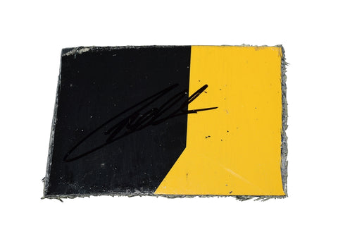 The 2022 Christopher Bell #20 DeWalt Racing yellow race-used sheet metal from Sonoma Raceway, signed by the driver. It includes a COA and fits inside a plastic toploader for display and protection, making it an ideal NASCAR collectible.