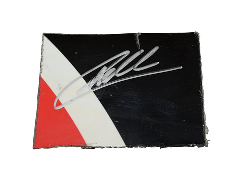 The signed 2022 Christopher Bell #20 DeWalt Racing black race-used sheet metal, a rare piece from Sonoma Raceway. This 3-color piece, authenticated with a COA, is ideal for display in a toploader.