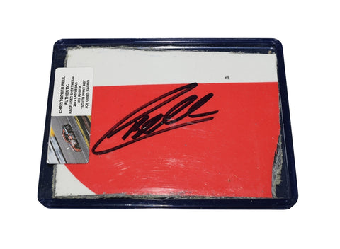 The signed 2022 Christopher Bell #20 Rheem Racing sheet metal from the South Point 400, used at Las Vegas Speedway. This collectible NASCAR piece fits perfectly inside a plastic toploader for display.