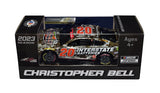 The 2023 Christopher Bell #20 Interstate Batteries Camo NASCAR Salutes diecast car, featuring Christopher Bell's signature obtained through exclusive public and private signings. Comes with a Certificate of Authenticity and a lifetime authenticity guarantee.