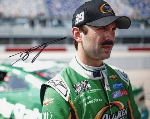 This autographed 2023 Daniel Suarez #99 Quaker State Racing Darlington Throwback Weekend photo captures the essence of NASCAR tradition. A great collectible for fans.