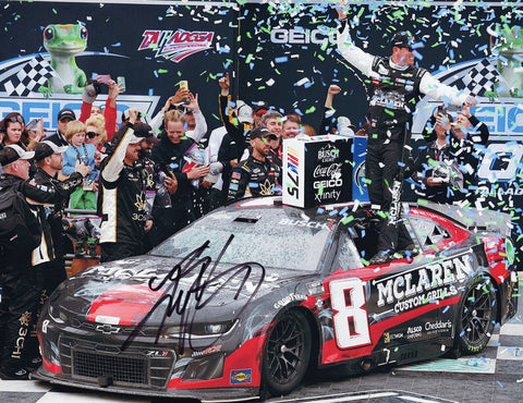 This autographed 2023 Kyle Busch #8 McLaren Grills Talladega Race Win photo shows Busch celebrating in Victory Lane surrounded by colorful confetti. Signed by the NASCAR star himself, the 9x11 inch glossy image includes a Certificate of Authenticity (COA), ensuring the signature’s legitimacy. It’s the perfect gift for fans and collectors alike.