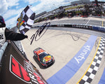 Limited edition autographed NASCAR photo capturing Martin Truex Jr.'s thrilling victory at Dover, a perfect addition to any racing collection.