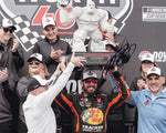 Experience the excitement of Martin Truex Jr.'s #19 Bass Pro Shops DOVER WIN with this signed NASCAR photo featuring the Monster Mile Trophy.