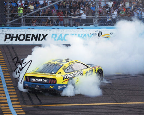 Autographed 2023 Ryan Blaney #12 Menards Racing 8x10 photo from his NASCAR Champion burnout at Phoenix Raceway. Signed by Blaney and authenticated with a Certificate of Authenticity (COA), perfect for NASCAR collectors.