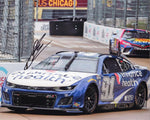 Signed 8x10 inch glossy photo of Shane Van Gisbergen’s #91 Enhance Health car at the 2023 Chicago Street Race, celebrating his victory. Includes Certificate of Authenticity (COA), making it a valuable collectible for NASCAR fans and collectors.