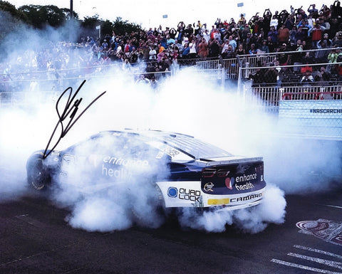 Capture the excitement of Shane Van Gisbergen’s 2023 Chicago Street Race win with this autographed 8x10 glossy photo, featuring his #91 Trackhouse Racing car in a burnout celebration. Includes a COA, making it a memorable NASCAR collectible.