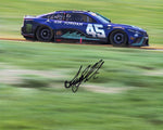 Signed 8x10 glossy photo of Tyler Reddick driving the #45 Air Jordan Racing car at the Charlotte Roval in 2023. Includes Reddick's signature and a Certificate of Authenticity (COA), perfect for NASCAR fans and collectors.