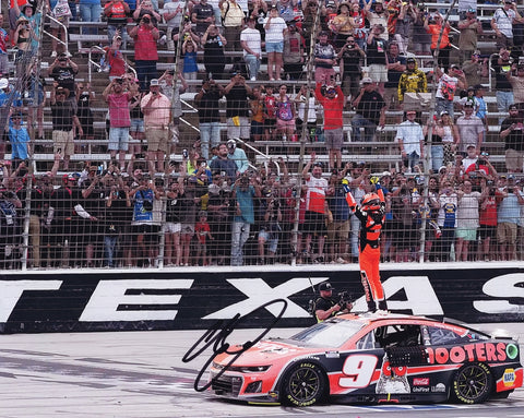 Autographed 2024 Chase Elliott #9 Hooters Racing Texas Win photo, showcasing Elliott during his exuberant victory celebration. This 8x10 inch glossy print is a must-have collectible for NASCAR fans, complete with a Certificate of Authenticity that verifies its legitimacy and value.